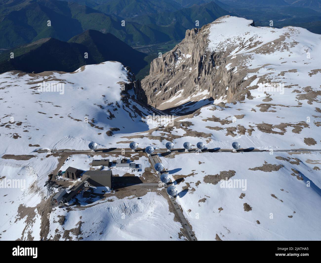 AERIAL VIEW. The Interferometer of the Bure Plateau wint the snow of May. Hautes-Alpes, France. Stock Photo