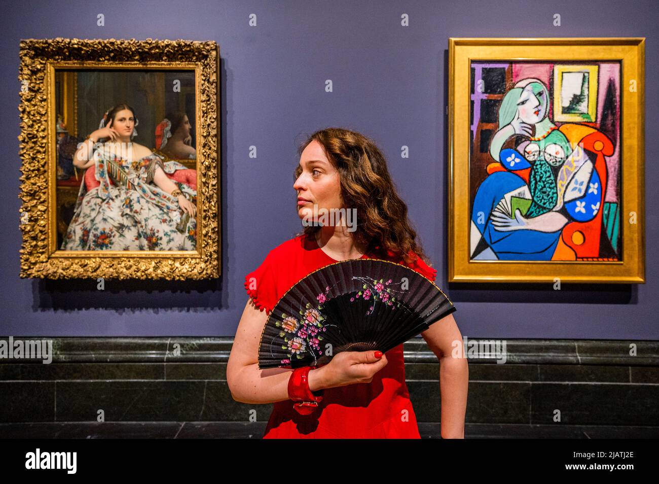 London, UK. 1st June, 2022. For the first time, Picasso's ‘Woman with a Book' (1932) from the Norton Simon Museum, California, is brought together with the painting that inspired it, ‘Madame Moitessier' (1856) by Jean-Auguste-Dominique Ingres, at the National Gallery. Credit: Guy Bell/Alamy Live News Stock Photo
