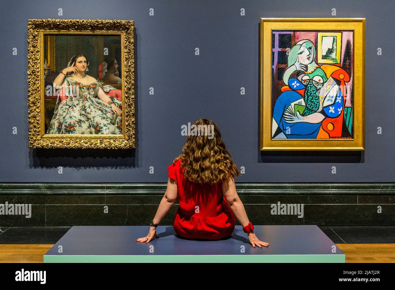 London, UK. 1st June, 2022. For the first time, Picasso's ‘Woman with a Book' (1932) from the Norton Simon Museum, California, is brought together with the painting that inspired it, ‘Madame Moitessier' (1856) by Jean-Auguste-Dominique Ingres, at the National Gallery. Credit: Guy Bell/Alamy Live News Stock Photo
