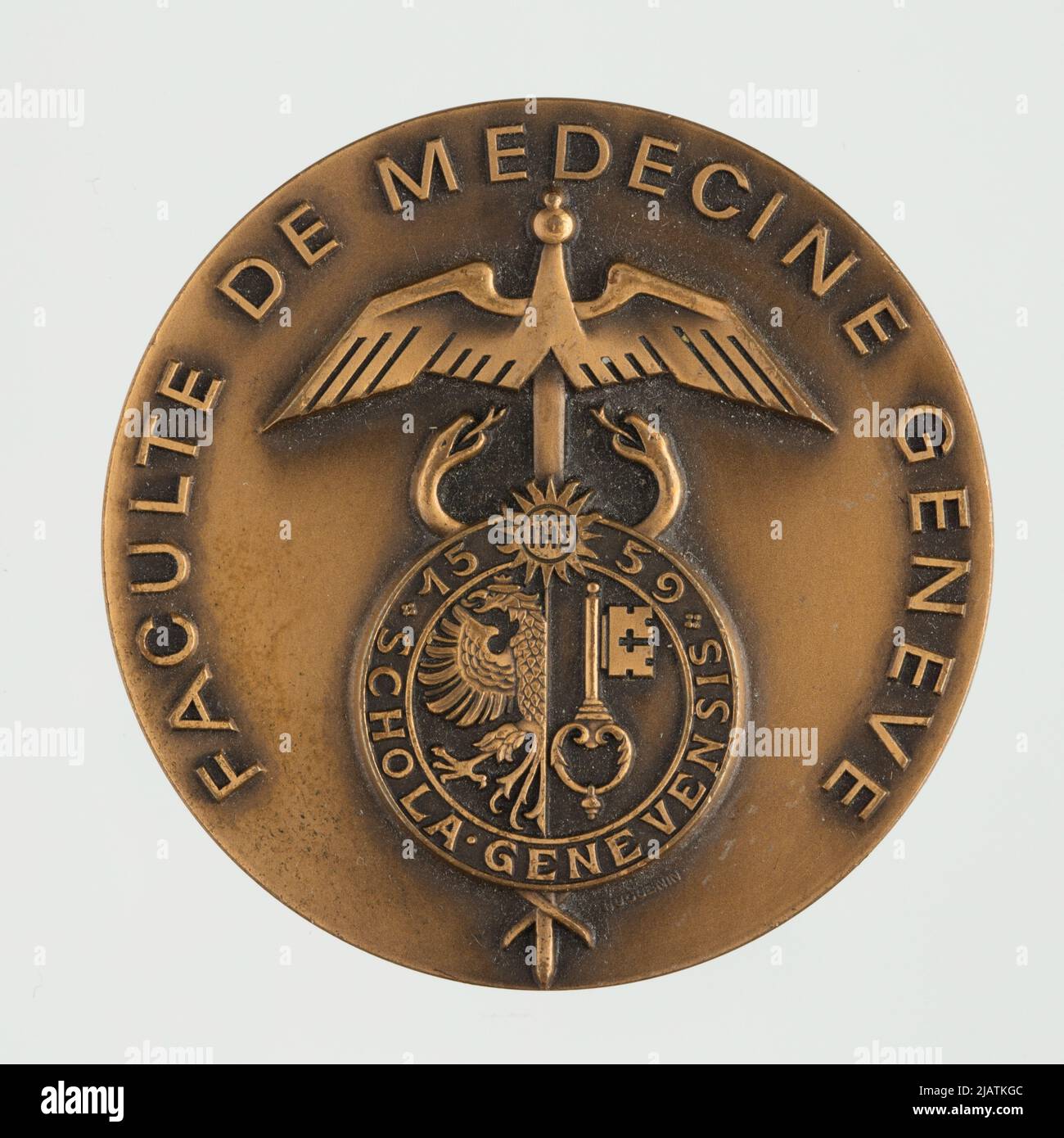 A medal commemorating the 100th anniversary of the Faculty of Medicine at the University of Geneva Huguenin Stock Photo