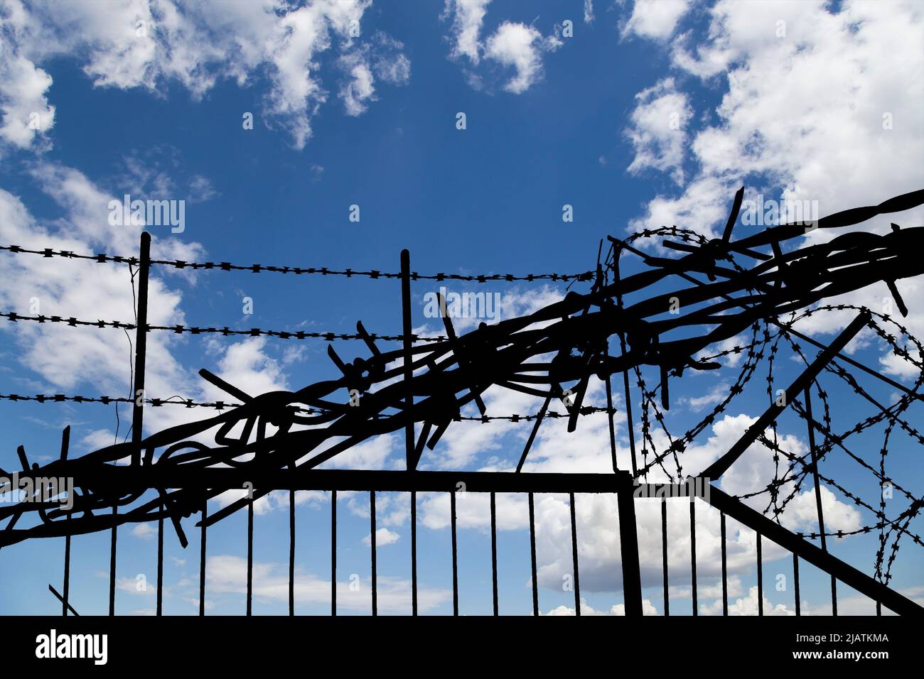 Сontour of barbed wire on background beautiful clouds and sky Stock ...
