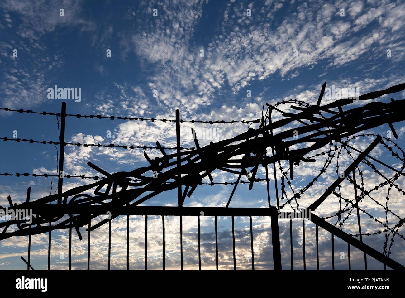 Сontour of barbed wire on background beautiful clouds and sky Stock ...