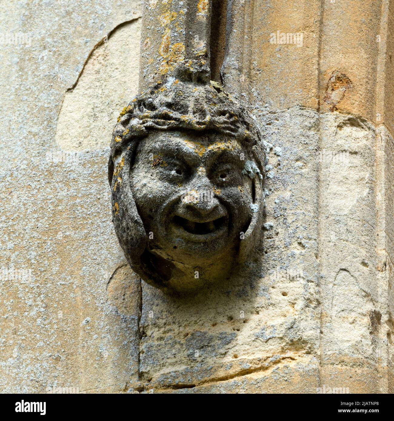 A carved head on the south face of St. Peter ad Vincula Church, Hampton Lucy, Warwickshire, England, UK Stock Photo