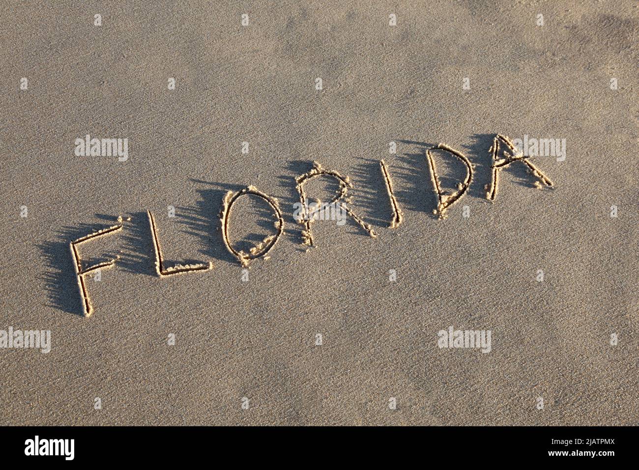 Florida drawn in the sand at the beach on an angle. Stock Photo