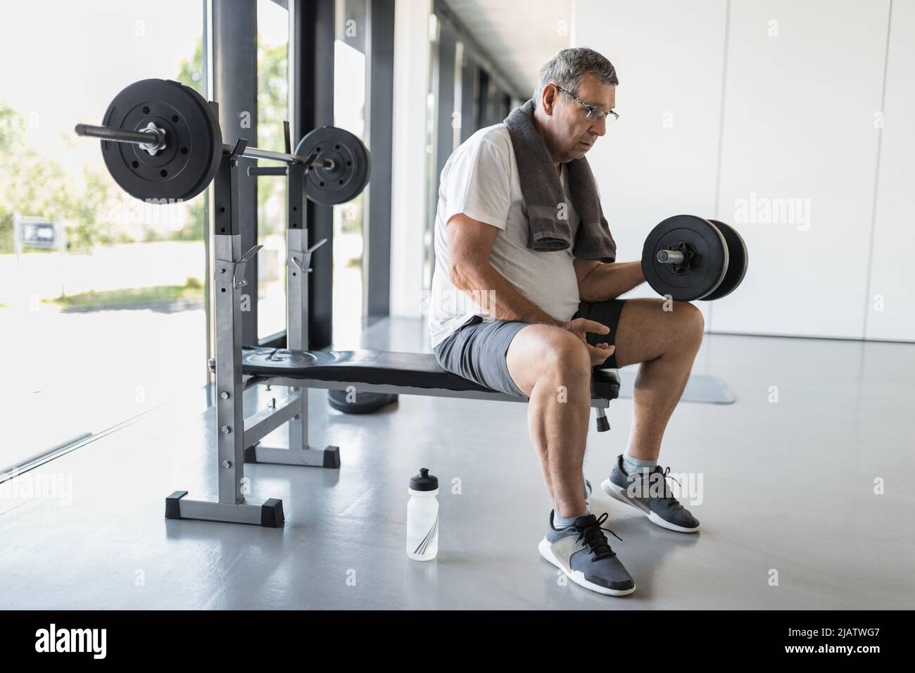 Active and healthy senior exercising in a gym Stock Photo