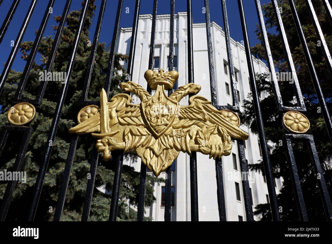 View to Defense Ministry of Russia in Moscow. Double-headed eagle on the metal fence, symbol of russian military Stock Photo