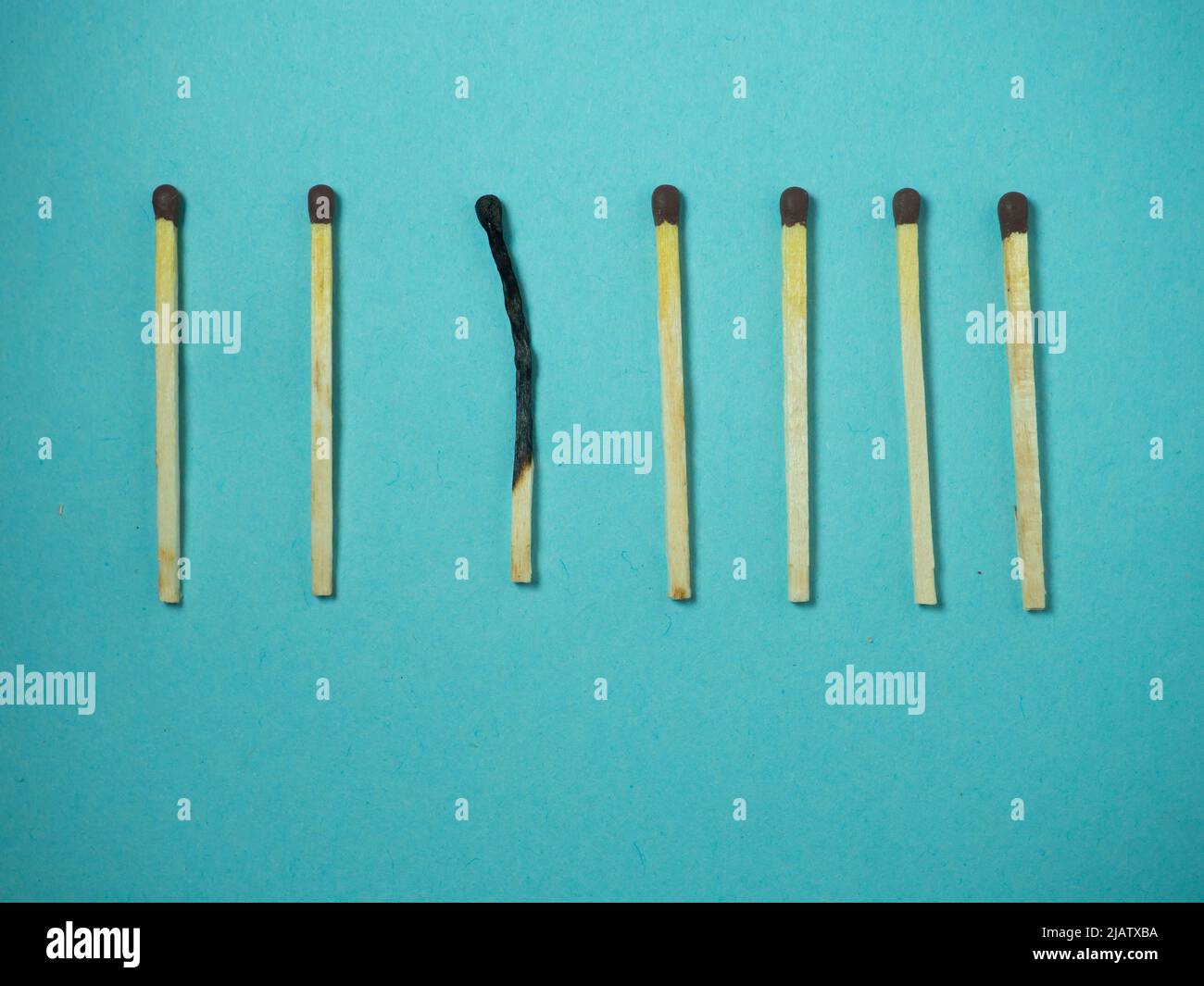 Matches on a blue background. Firestarting products. One against all