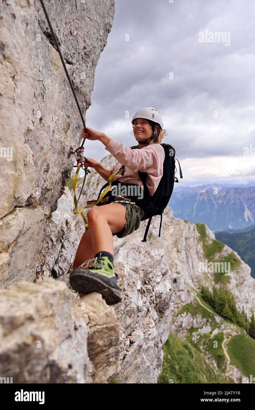 Young woman in the 'Friedberger' via ferrata in Tirol, Austria Stock Photo