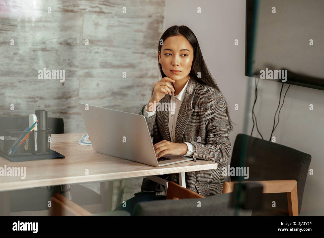 Pretty asian business woman working laptop sitting in modern office and ...