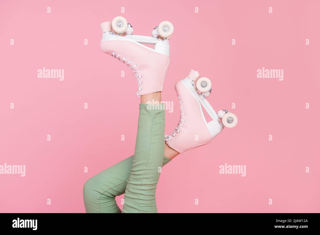 Cropped photo of slim legs wear pants roller skates sport hobby