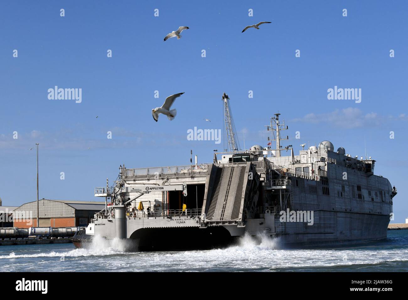 The Military Sealift Command Vessel, USNS Yuma enters Livorno port. Logisticians from multiple Southern European Task Force-Africa units including the 839th Transportation Battalion, the 173rd Airborne Brigade, the 207th Military Intelligence Brigade, and the 23rd Modular Ordnance Ammunition Company all worked together at the Port of Livorno, Italy to upload the Military Sealift Command Vessel, USNS Yuma. The equipment will transit from locations across Europe to Agadir, Morocco as part of exercise African Lion 22, Livorno, Italy, May 29, 2022. (U.S. Army photo by Elena Baladelli) Stock Photo