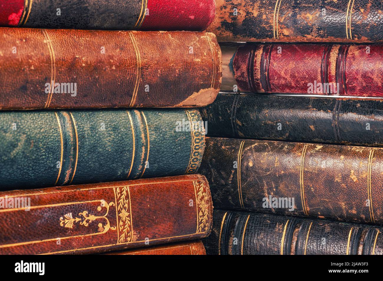 Old obsolete books pile covers close up for texture and background Stock Photo