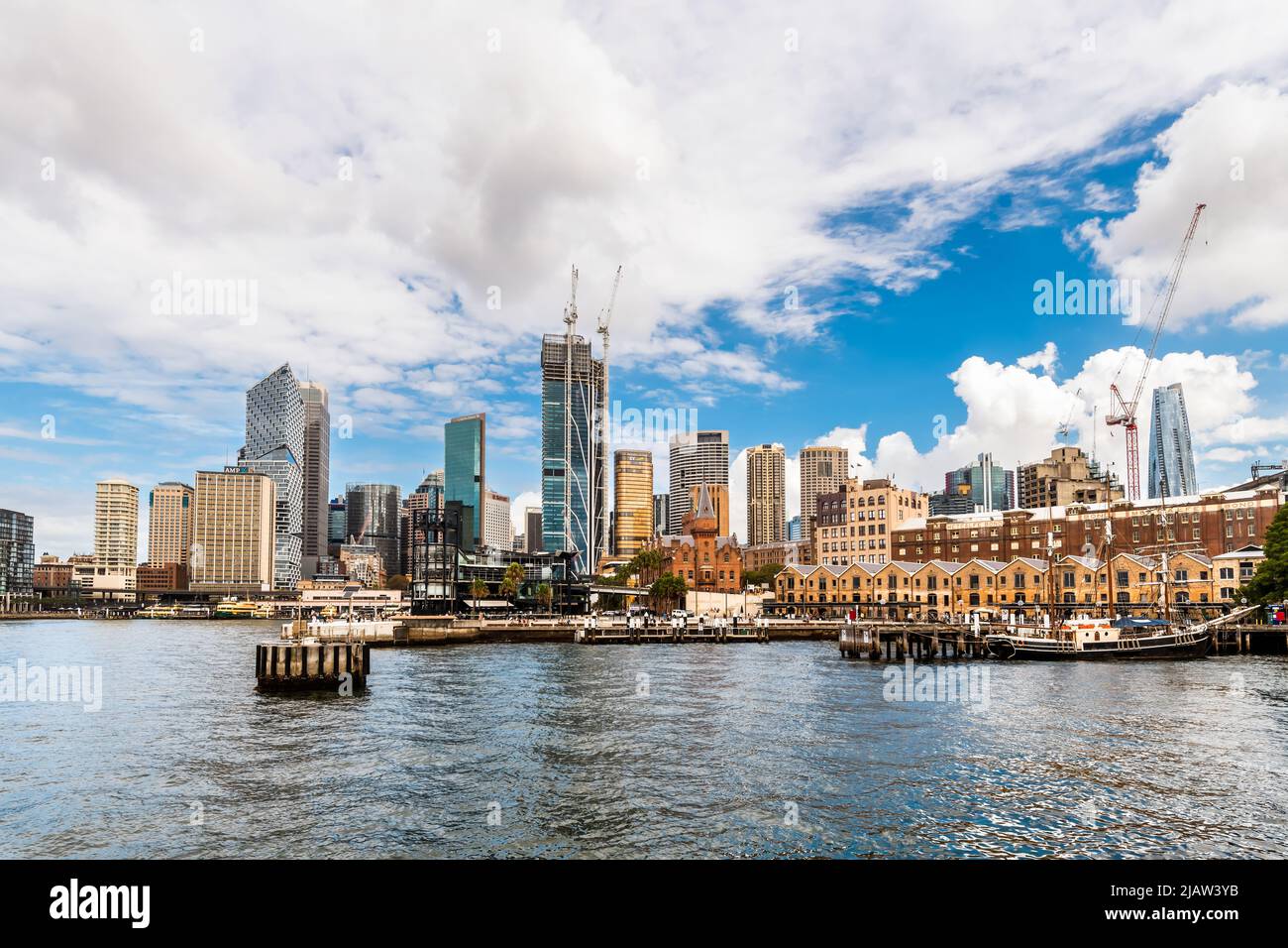 Sydney City, Australia - April 16, 2022: Sydney central business district and Circular Quay viewed through Campbells Cove from Hickson Road Reserve on Stock Photo