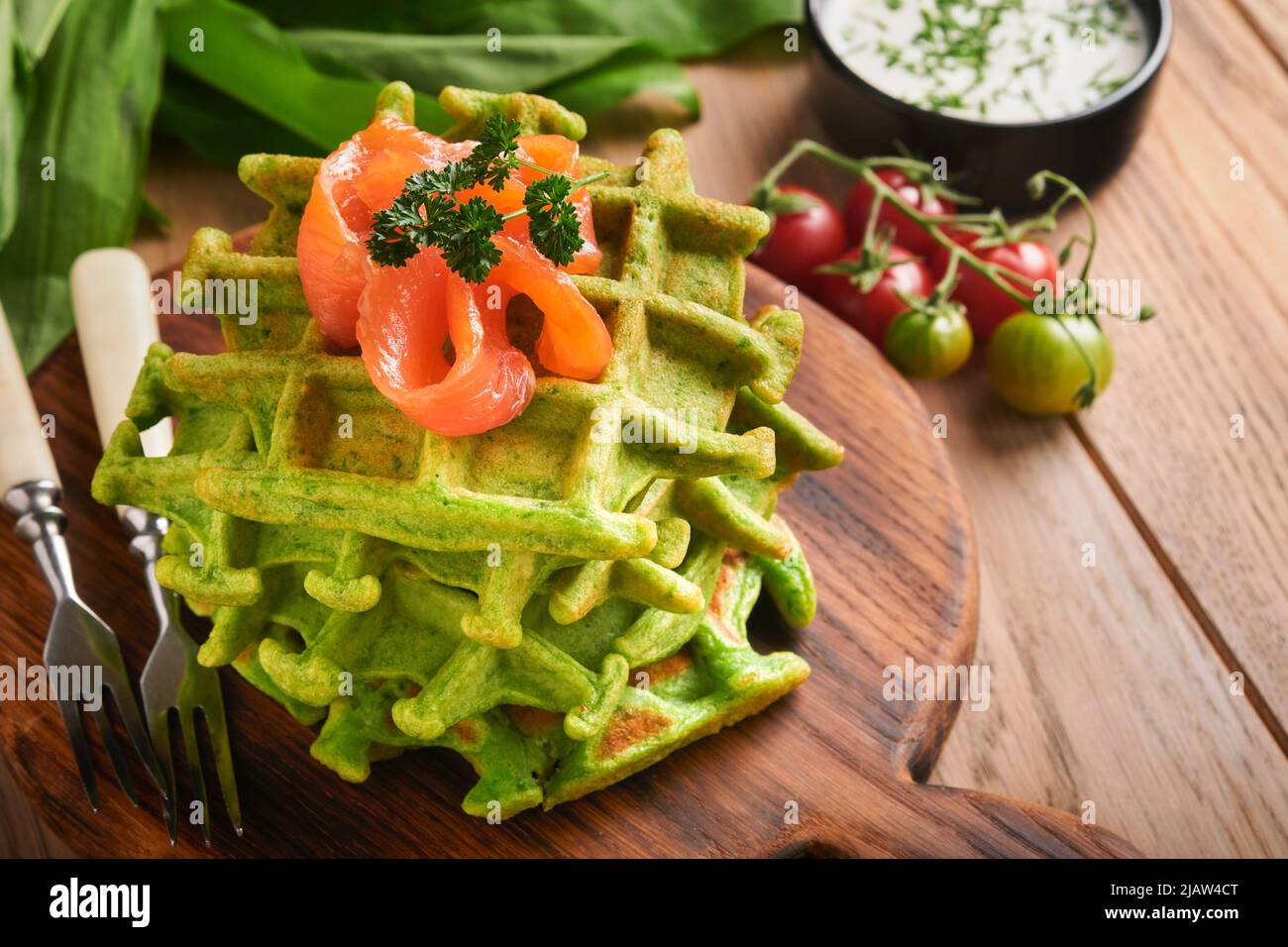 Green Belgian waffles. Spinach or wild garlic or pesto waffles with red