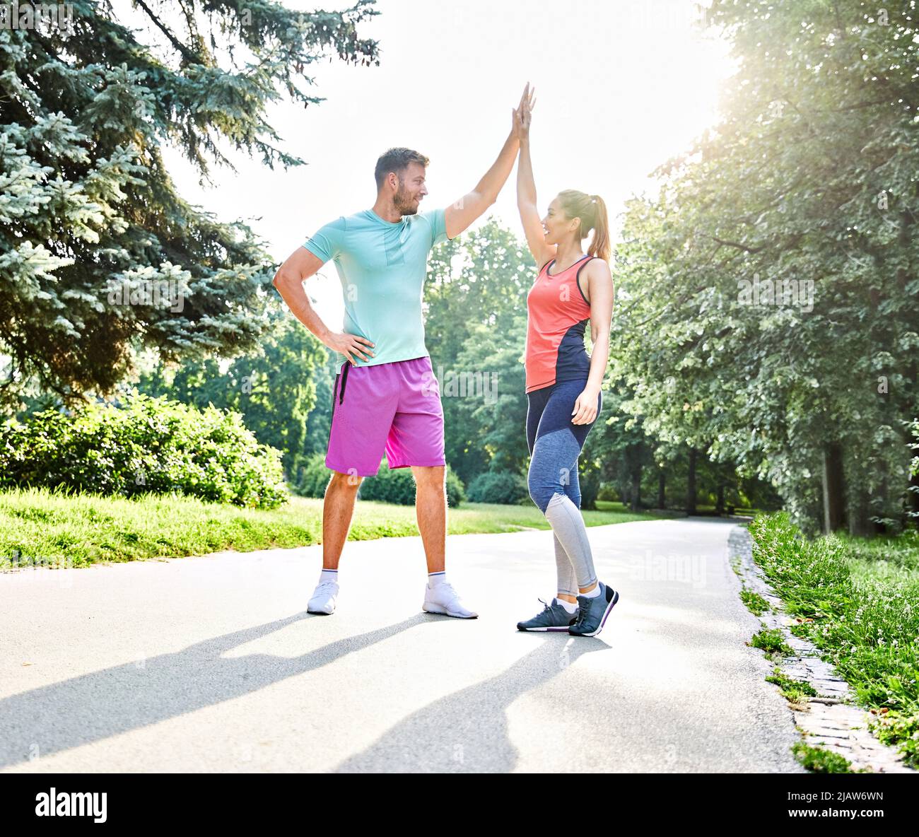 fitness woman park exercise lifestyle outdoor sport healthy couple nature active young fit training athlete Stock Photo