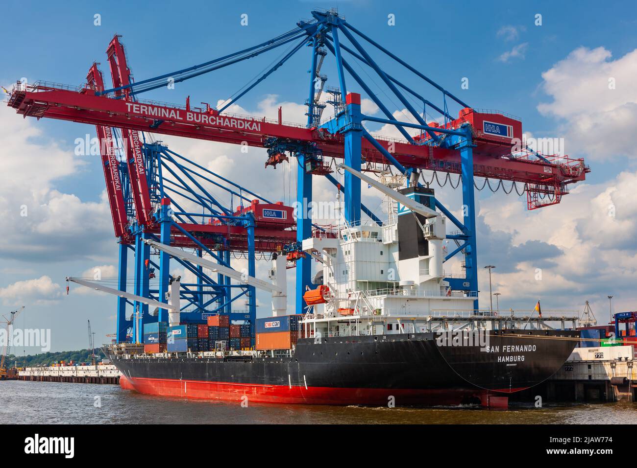 Hamburg, Germany - July 12, 2011 : Docks at Hamburg Harbor. Cargo and shipping industry on south shore of Elbe River. Stock Photo
