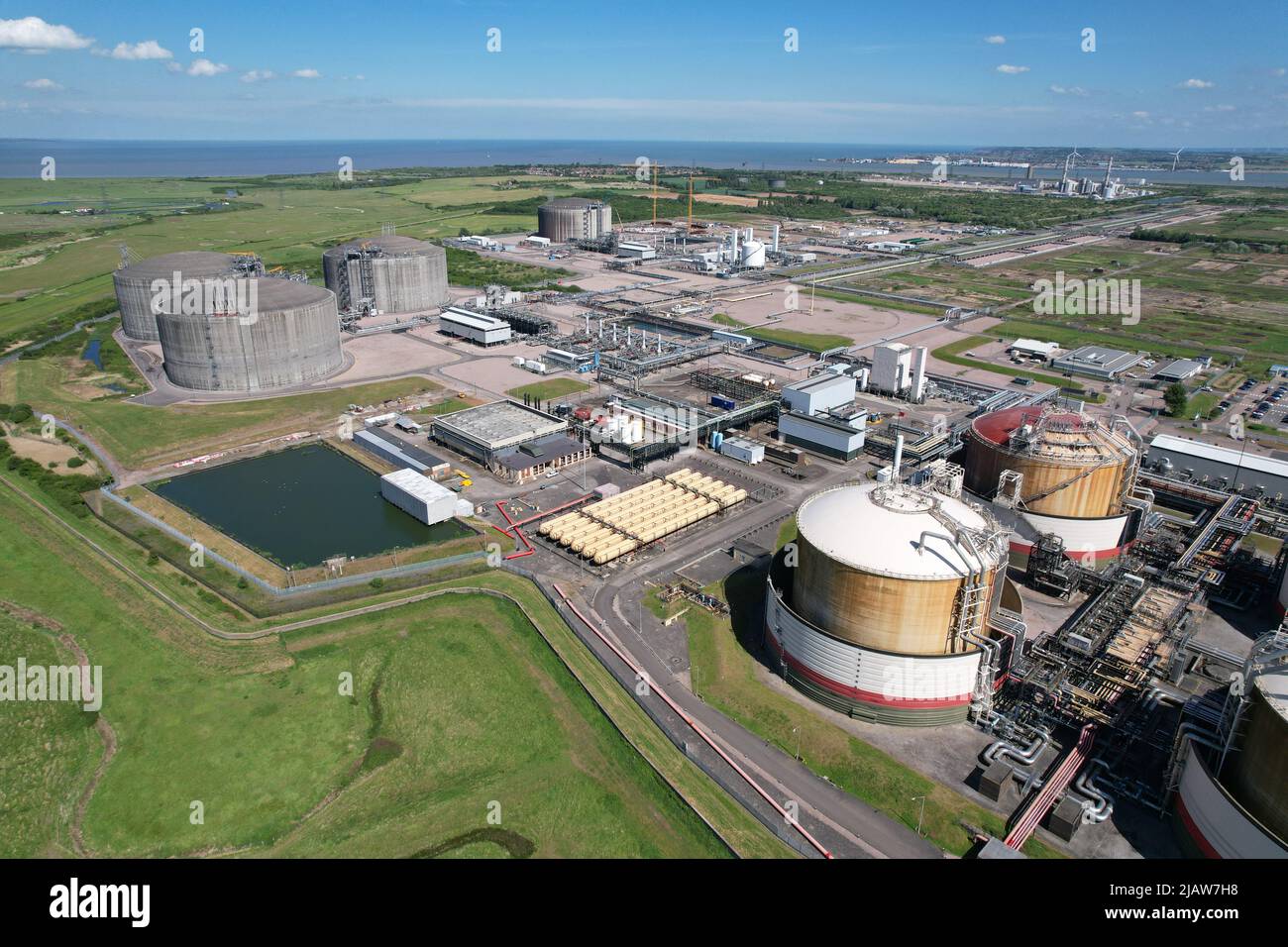 National grid Grain LNG Terminal gas storage Kent UK drone aerial view Stock Photo