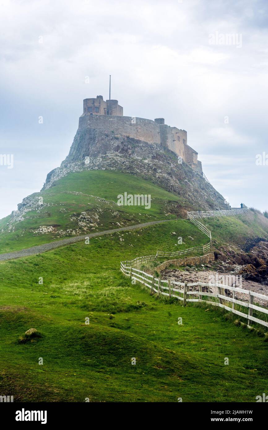 Lindisfarne Castle was built in the 16th. century and is accesible from the mainland at low tide by means of a causeway. Stock Photo