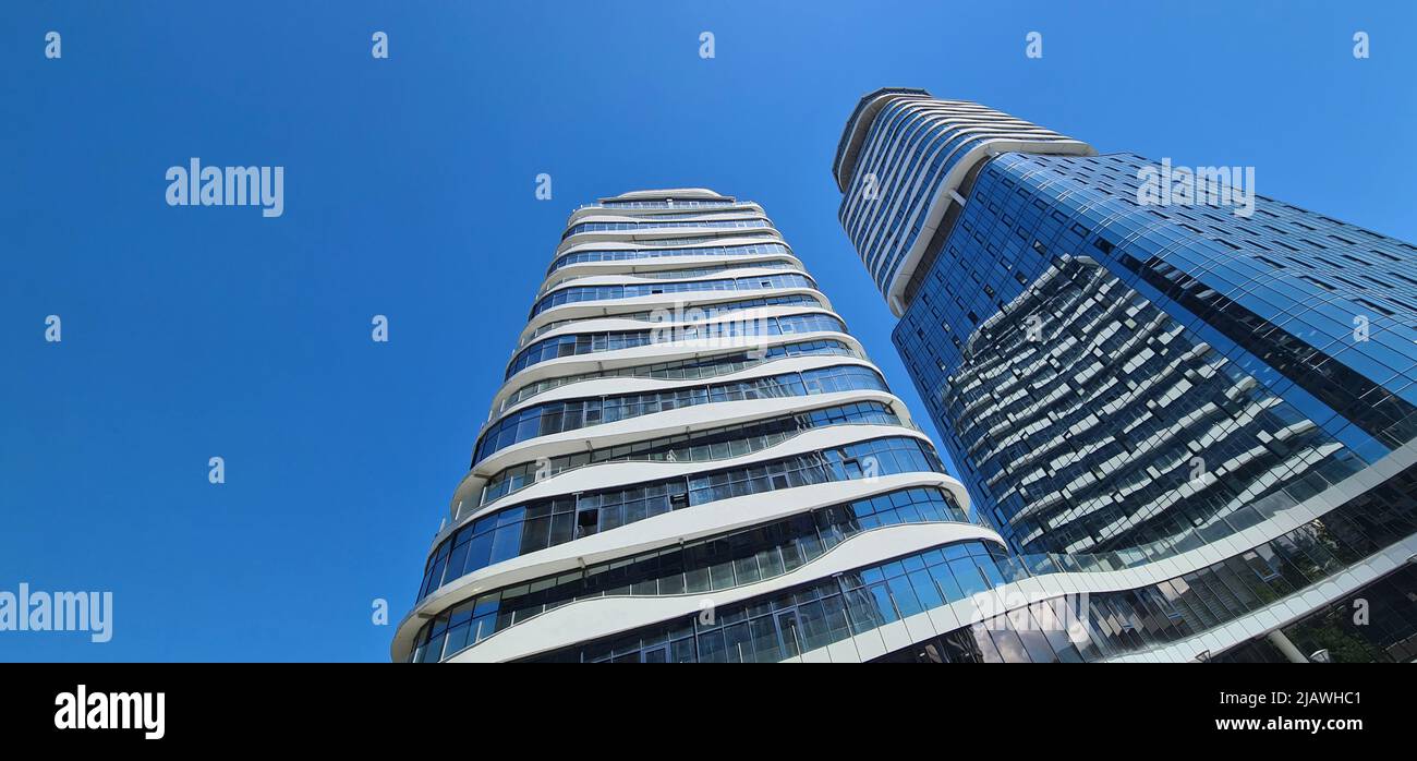 Office building with glass facades in business center Stock Photo