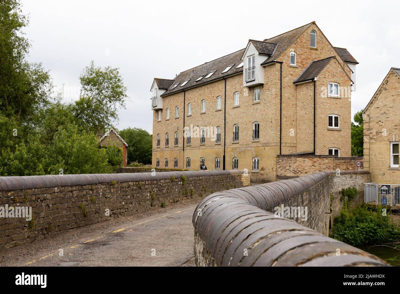 Narrow bridge leading to The Old Flour Mills, residential
