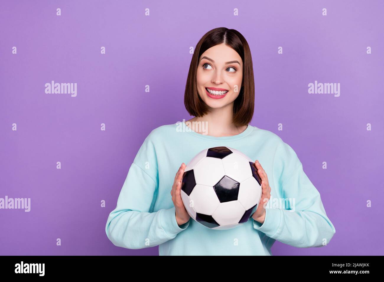 Photo portrait girl keeping soccer ball game fan looking copyspace