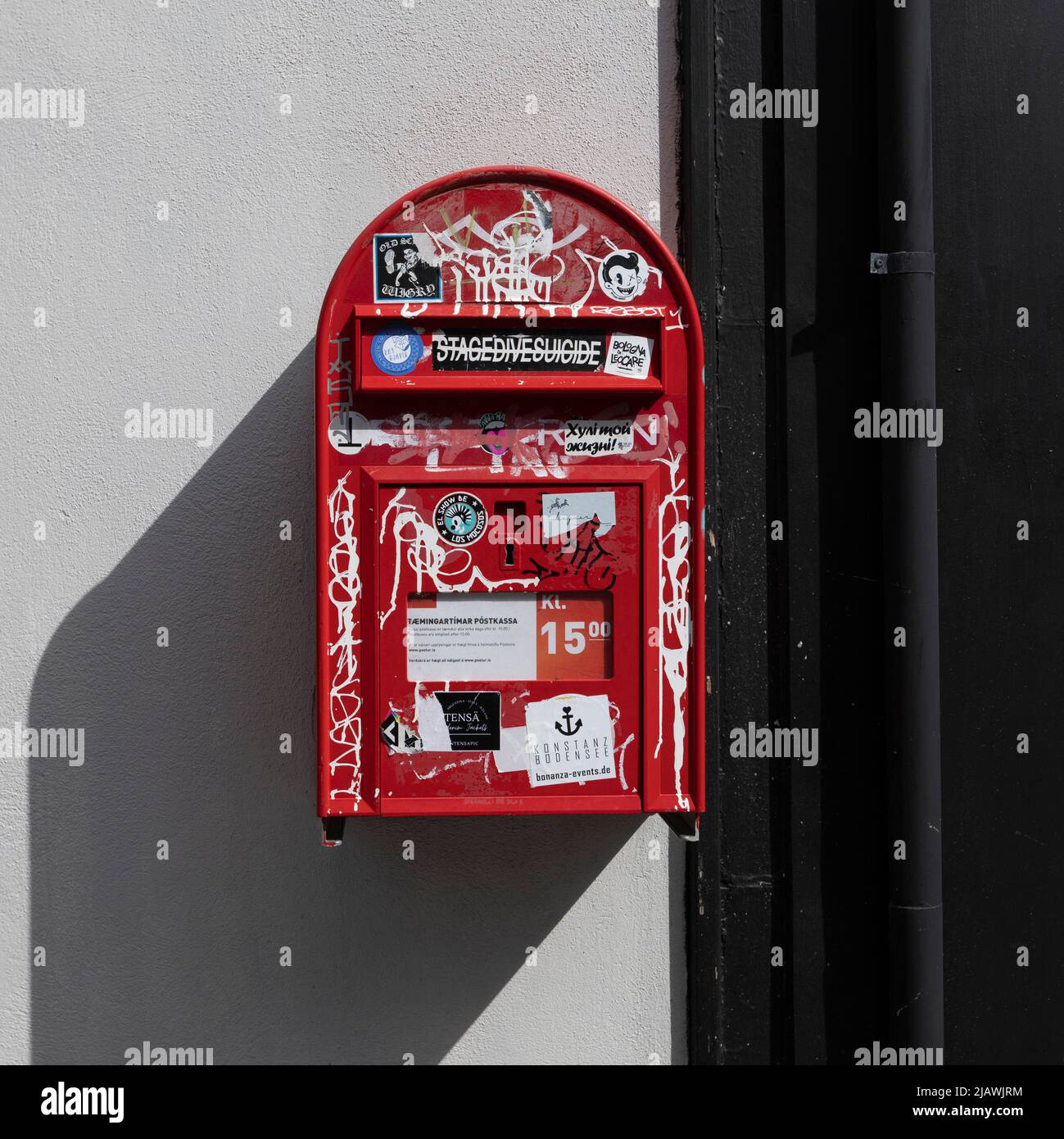 A post box covered in graffiti in Reykjavik Iceland Stock Photo