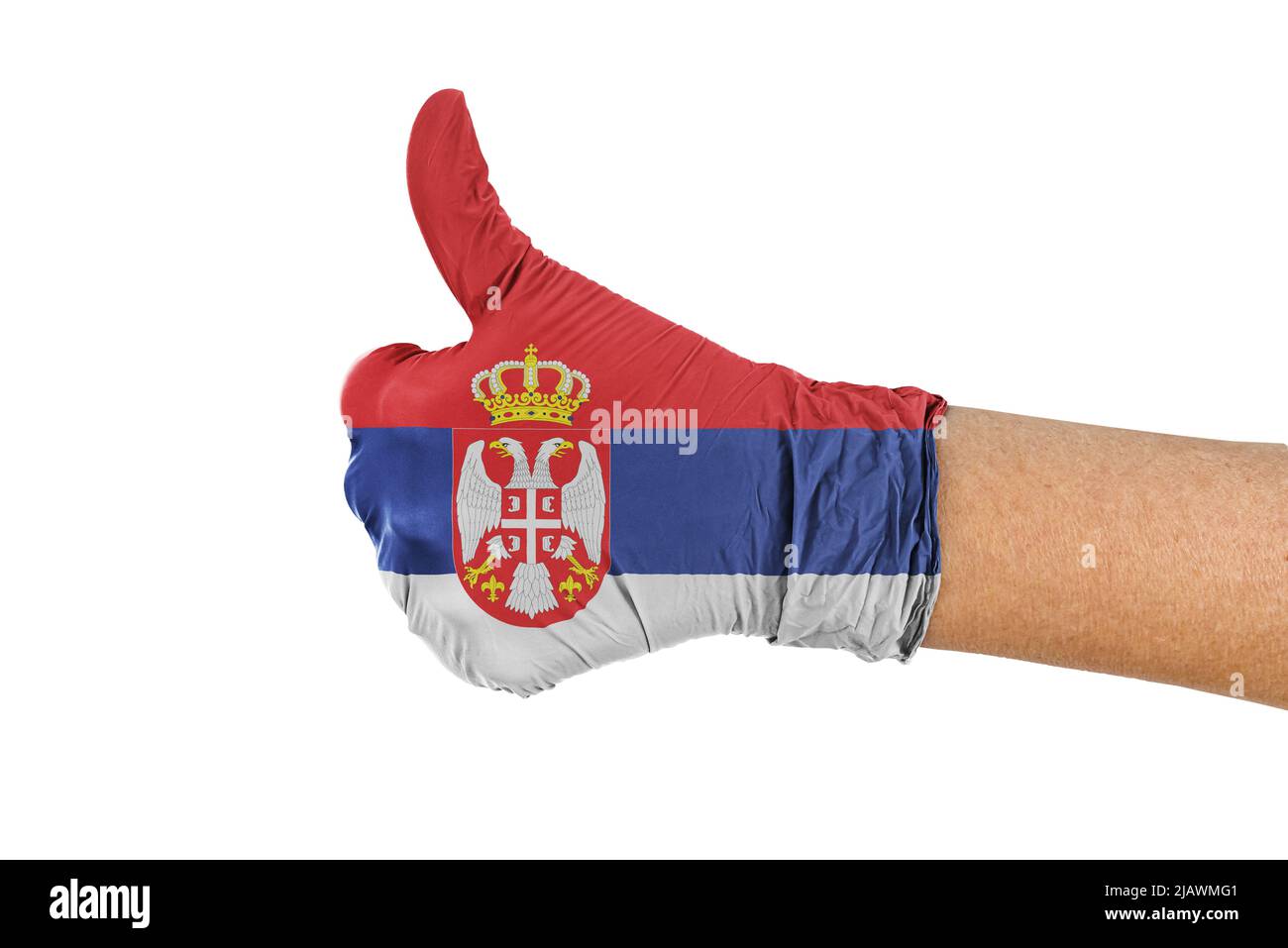 Serbia flag on a medical glove showing thumbs up sign Stock Photo