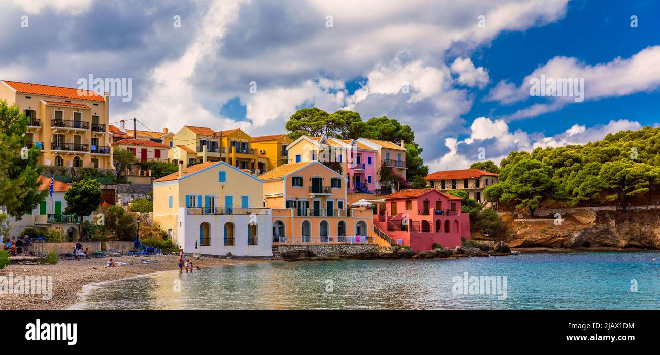 Turquoise colored bay in Mediterranean sea with beautiful colorful houses  in Assos village in Kefalonia, Greece. Town of Assos with colorful houses  on Stock Photo - Alamy
