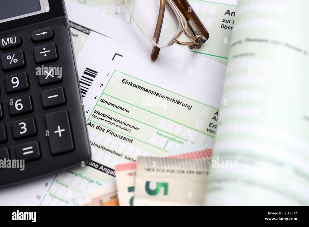 German income tax return form with european euro money bills and calculator  lies on accountant table close up. The concept of taxpaying period in Germ  Stock Photo - Alamy