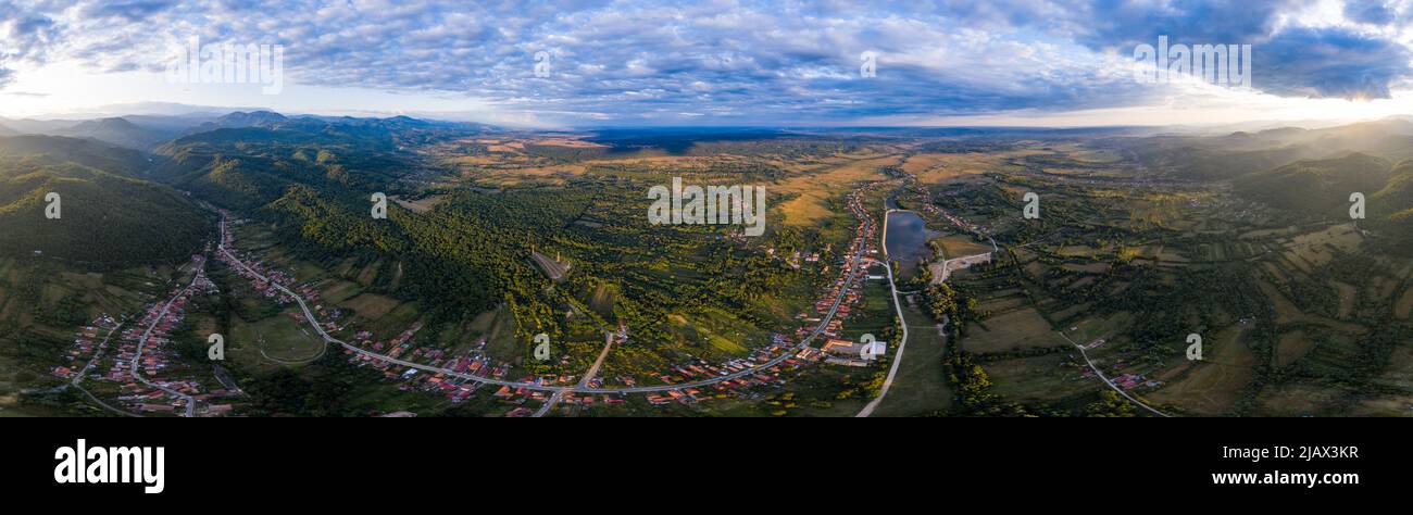 Beautiful Tismana lake and surrounding forest aerial panorama. Tismana, Romania. Stock Photo