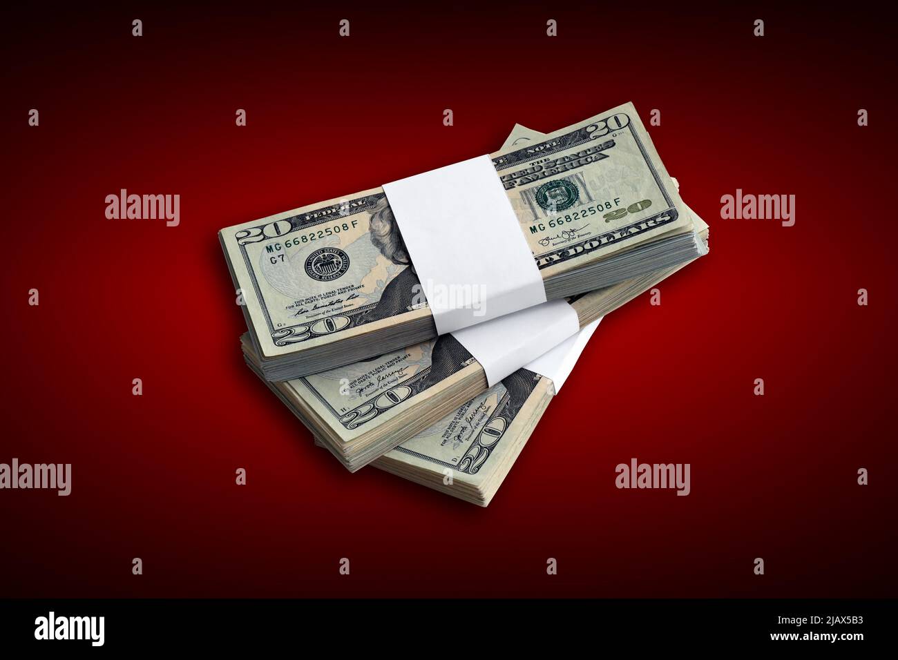 Bundle of US dollar bills on crimson red background. Pack of american ...