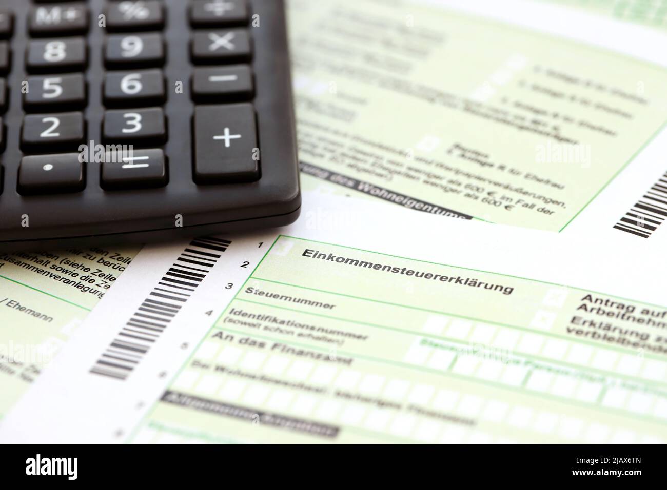 German annual income tax return declaration and calculator lies on  accountant table close up. The concept of taxpaying period in Germany and  Europe Stock Photo - Alamy