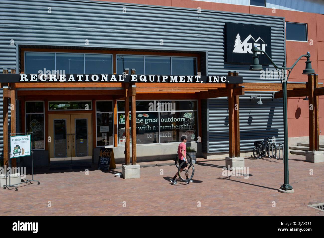A customer exits an REI (Recreational Equipment, Inc.) store in Santa