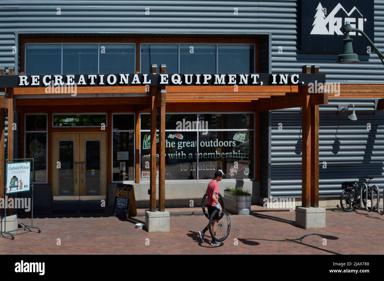 A customer exits an REI (Recreational Equipment, Inc.) store in Santa