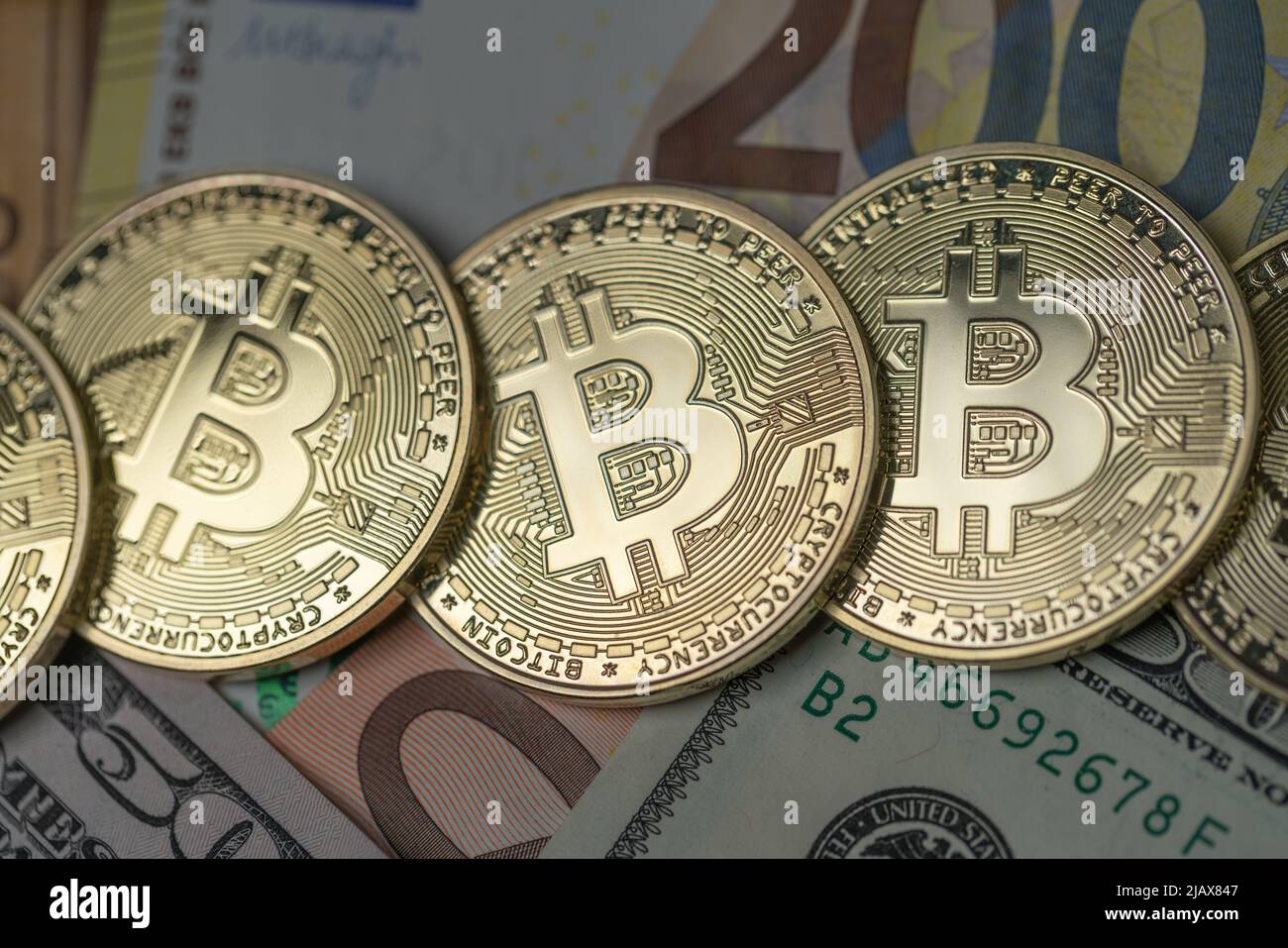 Bitcoin on dollar and euro banknotes. Digital money and paper money