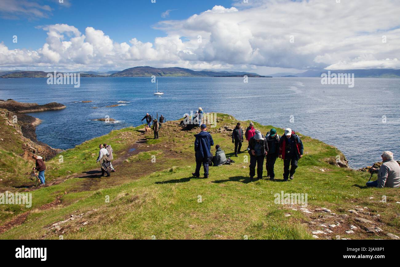 Tourists on day trip to Staffa an island of the Inner Hebrides in Argyll and Bute, Scotland, UK Stock Photo