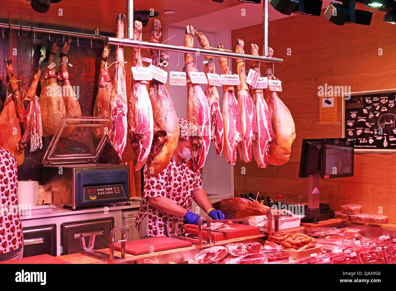 Cured Hams hang over Market stall, Tarragona Stock Photo Alamy