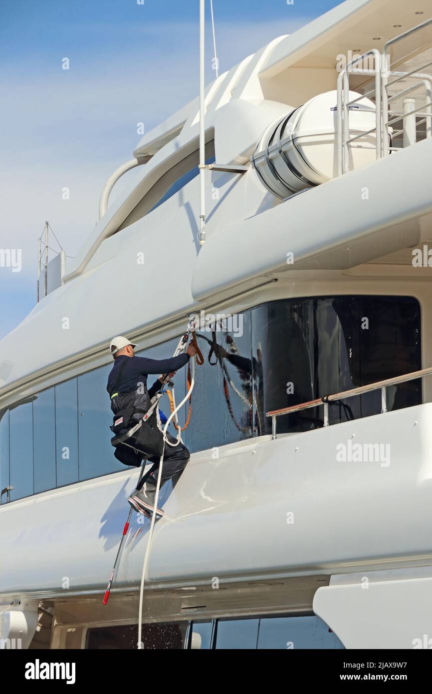 Window washing on superyacht 'Only Eighty', Tarragona Stock Photo