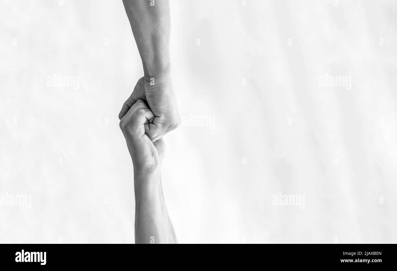 Rescue, helping gesture or hands. Two hands, helping arm of a friend, teamwork. Helping hand outstretched. Friendly handshake, friends greeting Stock Photo