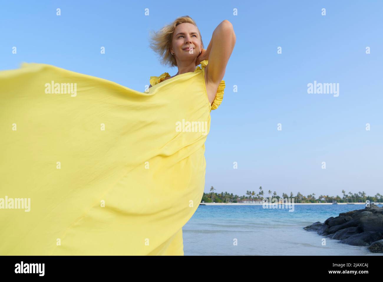 Woman windy day dress hi-res stock photography and images - Alamy