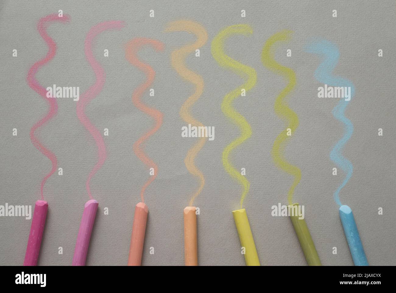 Close up view colorful pastel crayons and pigments on begie background Stock Photo