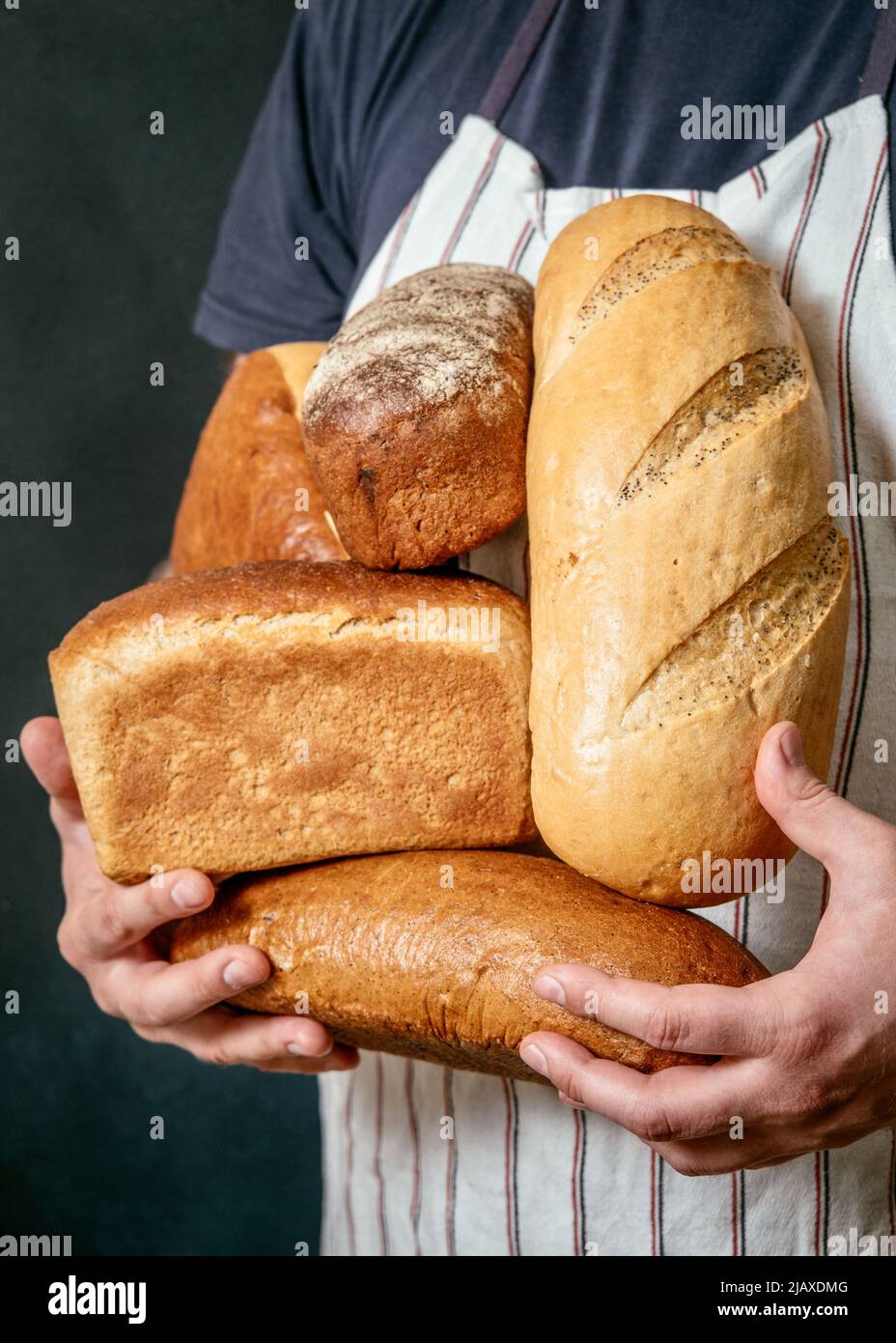 Man holding bread in hands Stock Photo Alamy