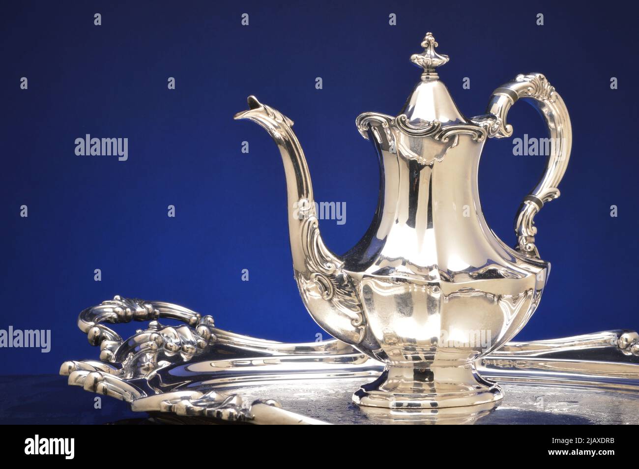 Antique silver coffee pot and silver tray Stock Photo
