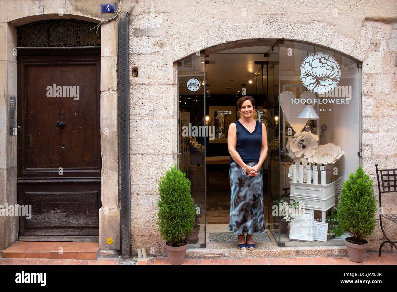 Jessica Buchanan, a perfume maker from Canada, portrayed in front of her shop “1000 flowers” in Grasse, France on September 9, 2021. Jessica came to Provence in 2007 to attend the Grasse Institute of Perfumery. Today she has her own boutique in Grasse and is what's known in the business as a nose, or a nez in French. 'We do learn how to smell,' Buchanan says. 'That part of the brain really develops. It's like a muscle. It becomes more developed in a perfumer than in a regular person who's not paying attention to scents every day.' Grasse has had a prospering perfume industry since the end of t Stock Photo