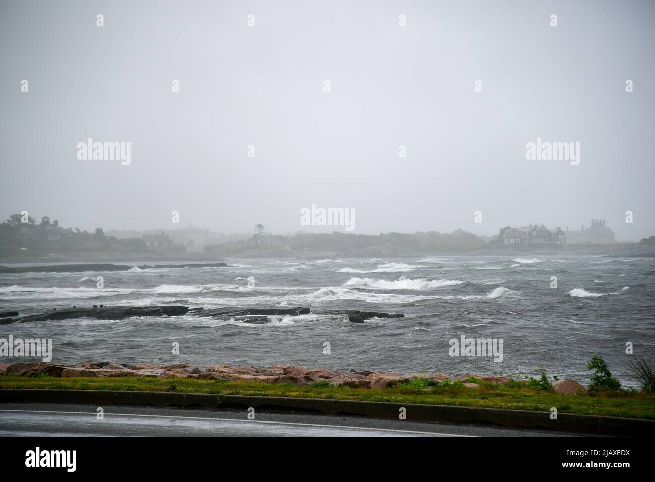 Stock photos of Tropical Storm Elsa from 2021 drenching Newport, Rhode Island. Breaking waves in Newport Harbor during a storm on Aquidneck Island. Stock Photo