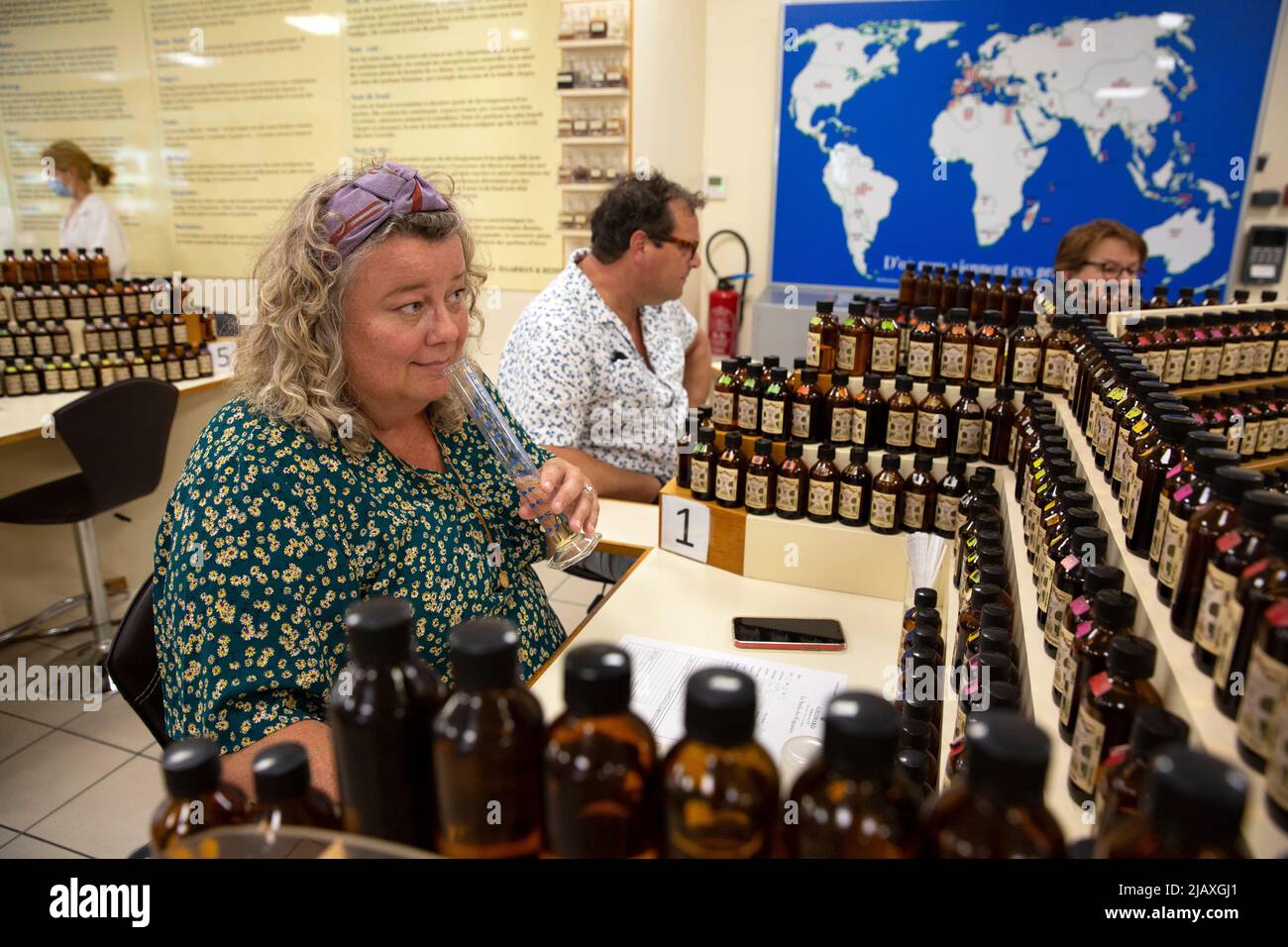 Mariska Lokker (L), 49, and her husband Paul Lokker (R), 45, both tourists from the Netherlands, creating their own fragrance during a workshop at the Galimard Studio des Fragrances in Grasse, France on September 10, 2021. Grasse has had a prospering perfume industry since the end of the 18th century and is considered the world's capital of perfume. There are numerous of old 'parfumeries' in Grasse, such as Galimard, Molinard and Fragonard, each with tours and a museum. Many 'noses' ('Les nez' in French) are trained or have spent time in Grasse to distinguish over 2,000 kinds of scent. Grasse Stock Photo