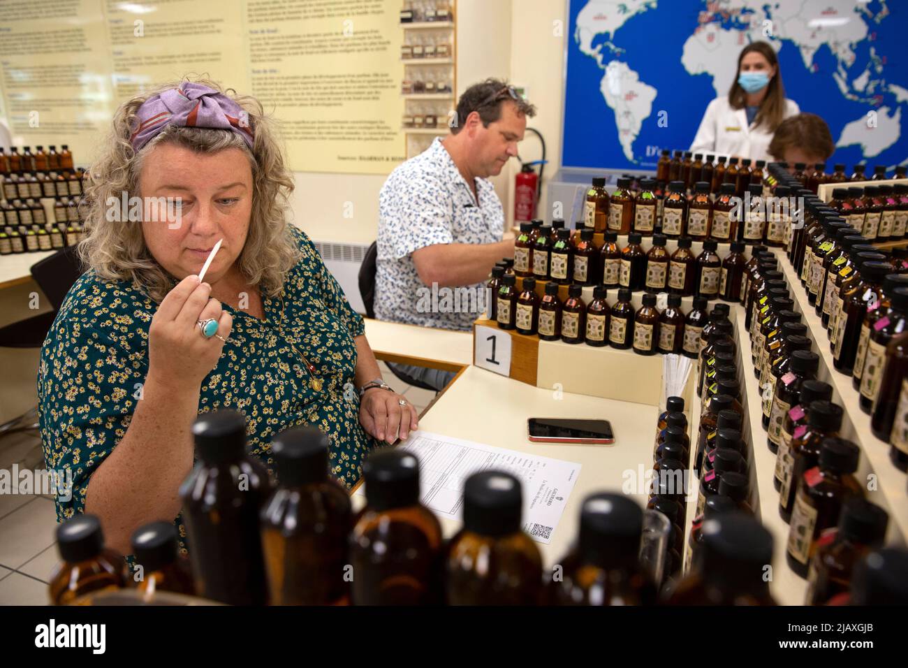 Mariska Lokker (L), 49, and her husband Paul Lokker (R), 45, both tourists from the Netherlands, creating their own fragrance during a workshop at the Galimard Studio des Fragrances in Grasse, France on September 10, 2021. Grasse has had a prospering perfume industry since the end of the 18th century and is considered the world's capital of perfume. There are numerous of old 'parfumeries' in Grasse, such as Galimard, Molinard and Fragonard, each with tours and a museum. Many 'noses' ('Les nez' in French) are trained or have spent time in Grasse to distinguish over 2,000 kinds of scent. Grasse Stock Photo