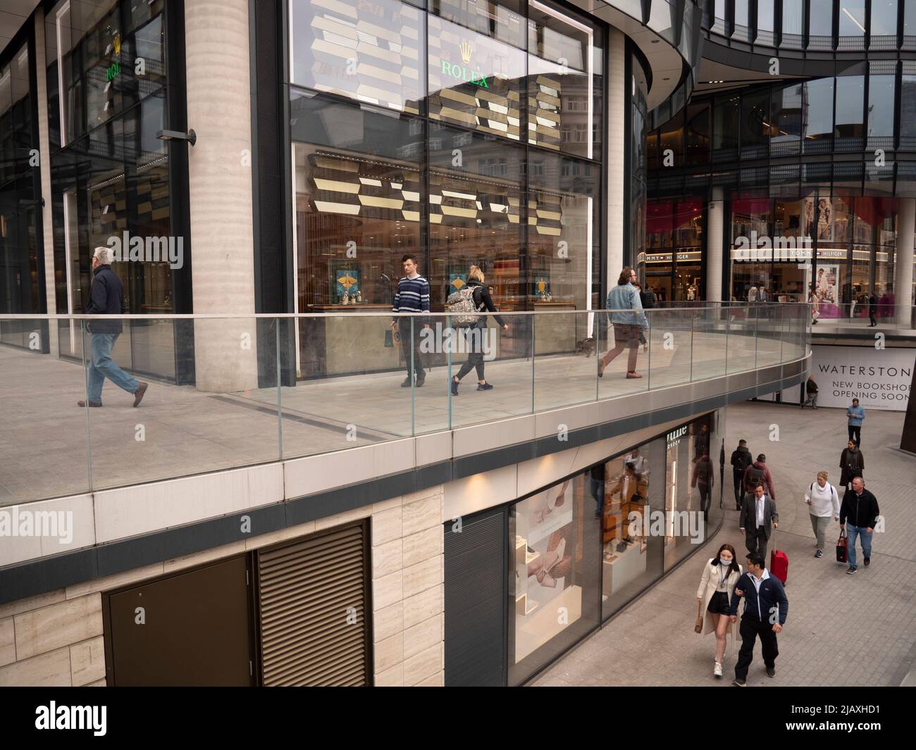 Broadgate Circle shopping centre, with Rolex and Tommy Hilfiger shops in  background Broadgate London Stock Photo - Alamy