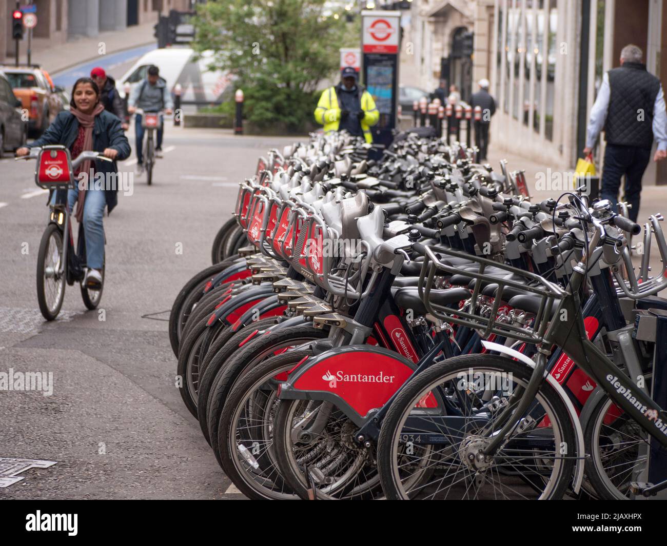 Rows of Santander rental bikes for hire in Central London Stock Photo