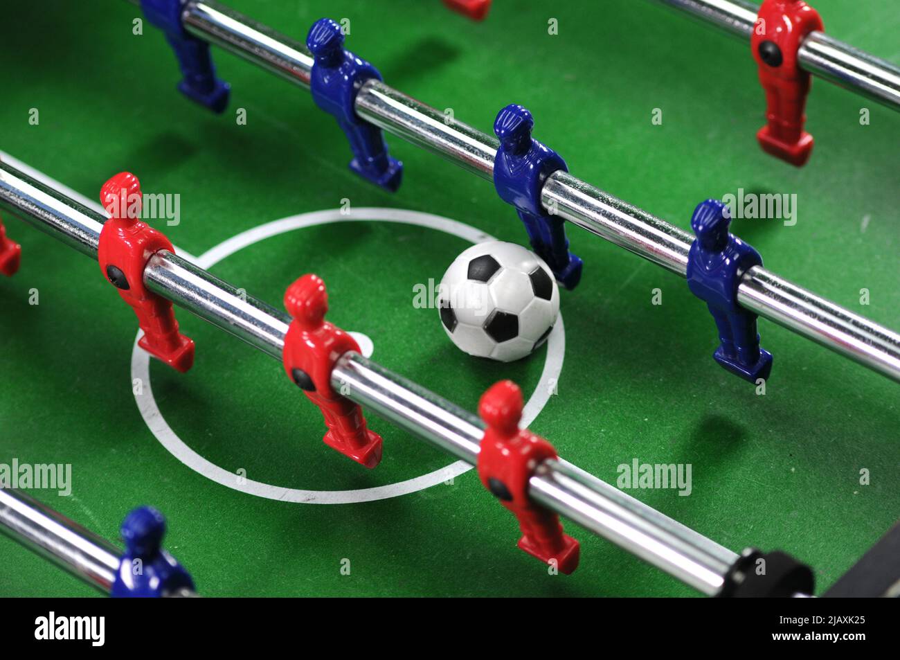 Table football game, or table soccer, close up. Confrontation concept. Stock Photo
